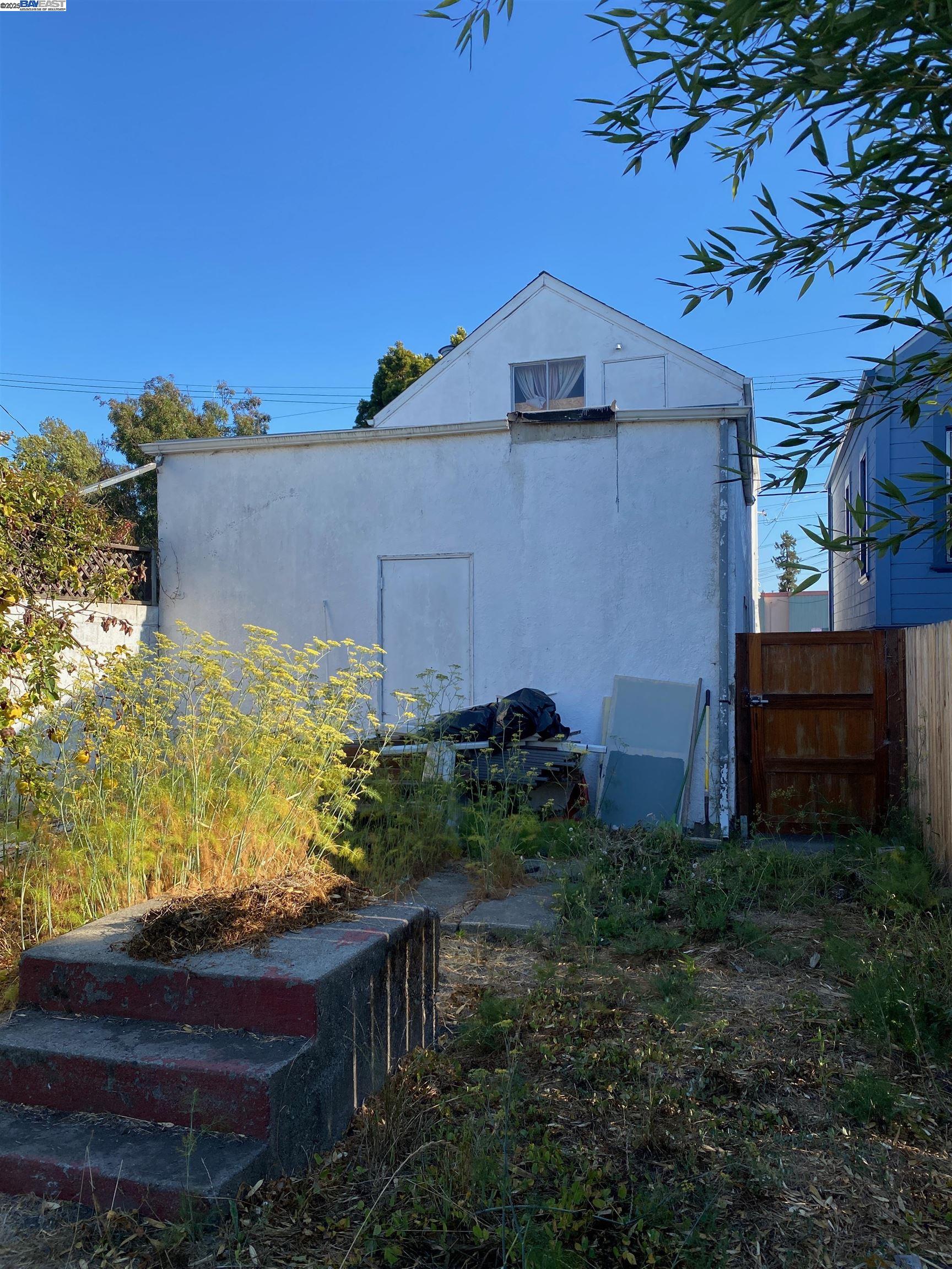 1124 63rd Street Oakland, CA 94608 - Photo 14 of 15 a house view with a garden space
