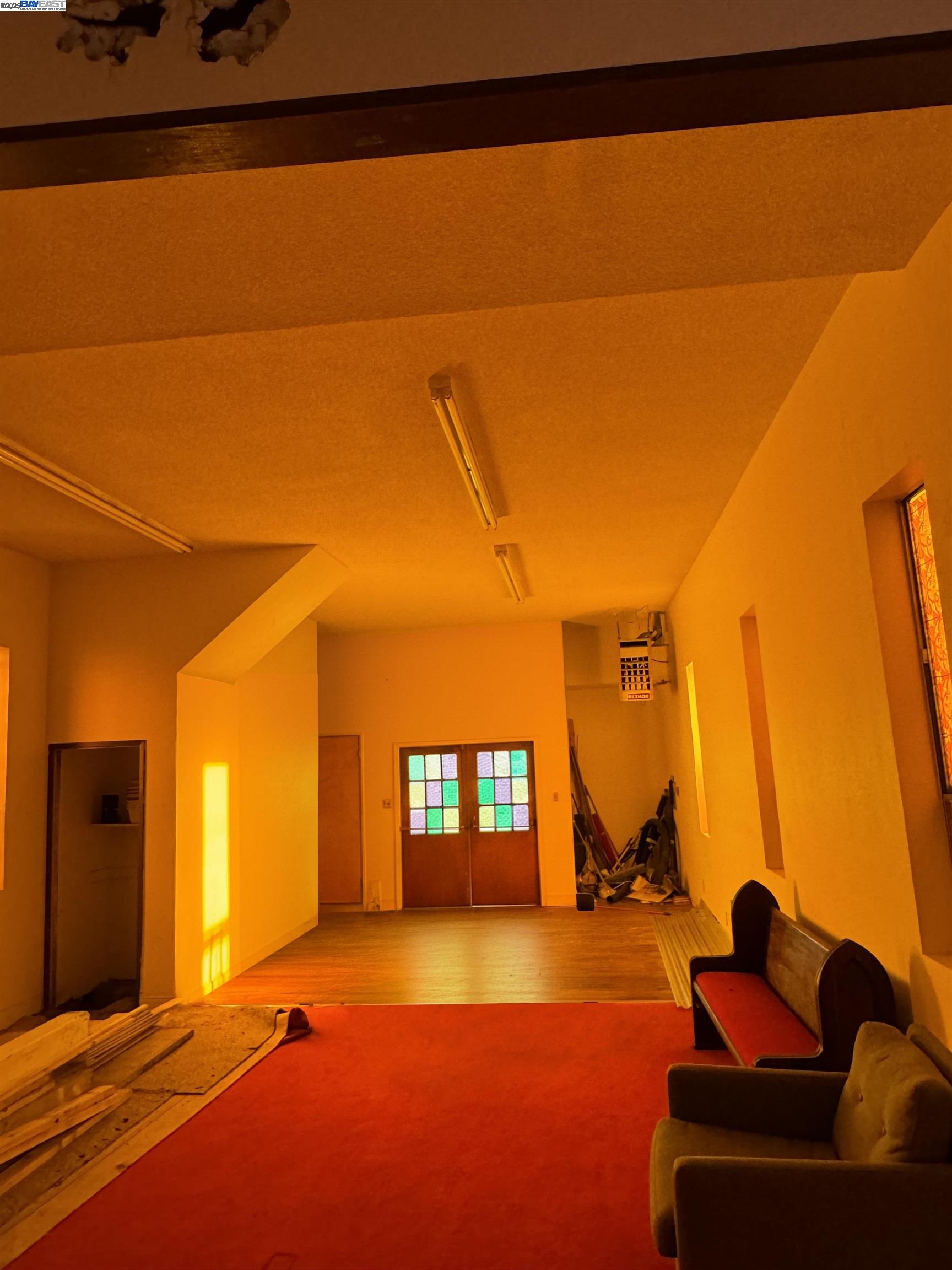 1124 63rd Street Oakland, CA 94608 - Photo 3 of 15 a living room with furniture and a flat screen tv