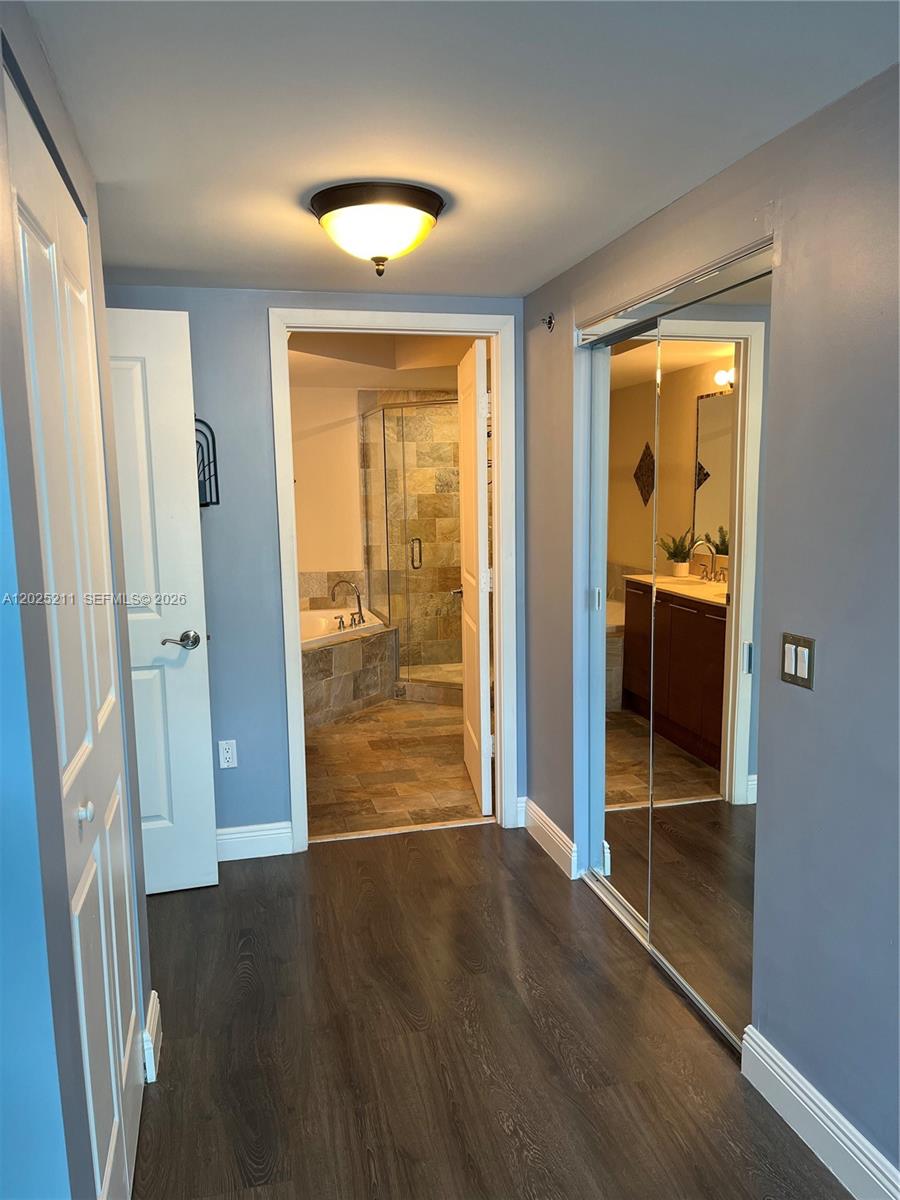 2681 North Flamingo Road, Unit 303S Sunrise, FL 33323 - Photo 9 of 18 an empty room with wooden floor and entrance