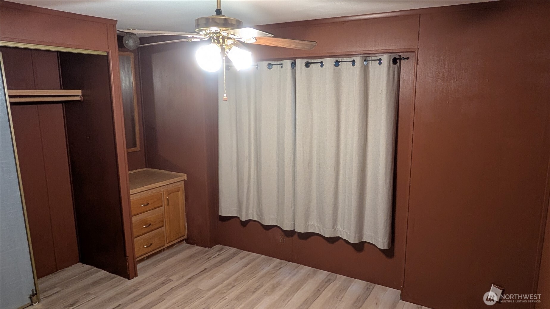 17340 Sargent Road Southwest, Unit 66 Rochester, WA 98579 - Photo 2 of 11 a view of a utility room with closet and wooden floor