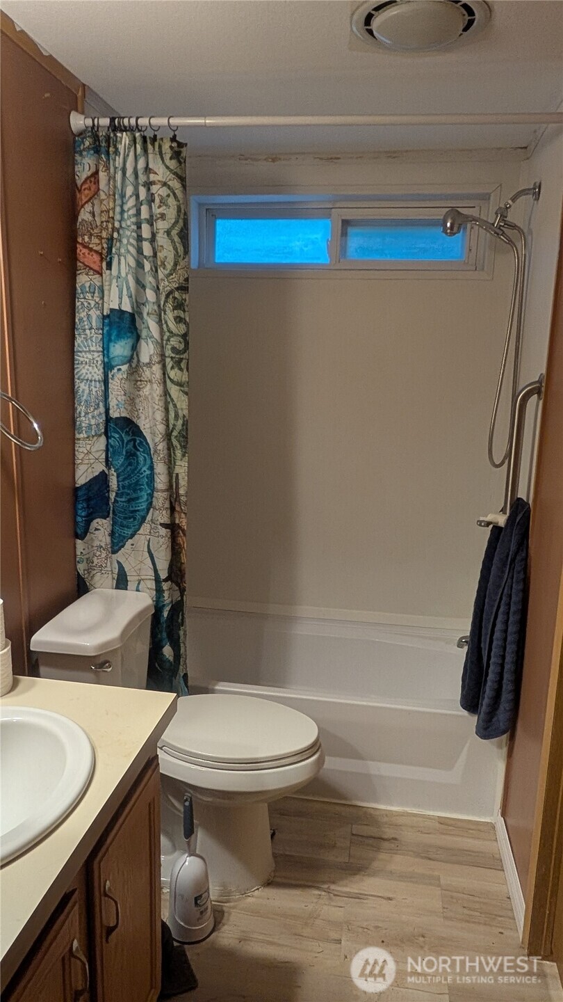 17340 Sargent Road Southwest, Unit 66 Rochester, WA 98579 - Photo 3 of 11 a bathroom with a sink toilet and shower