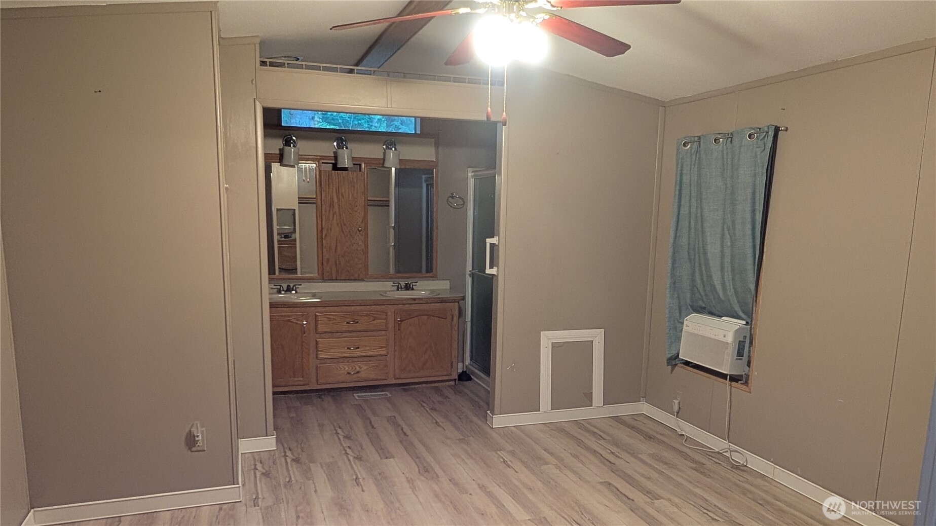 17340 Sargent Road Southwest, Unit 66 Rochester, WA 98579 - Photo 9 of 11 wooden floor with closet in an empty room