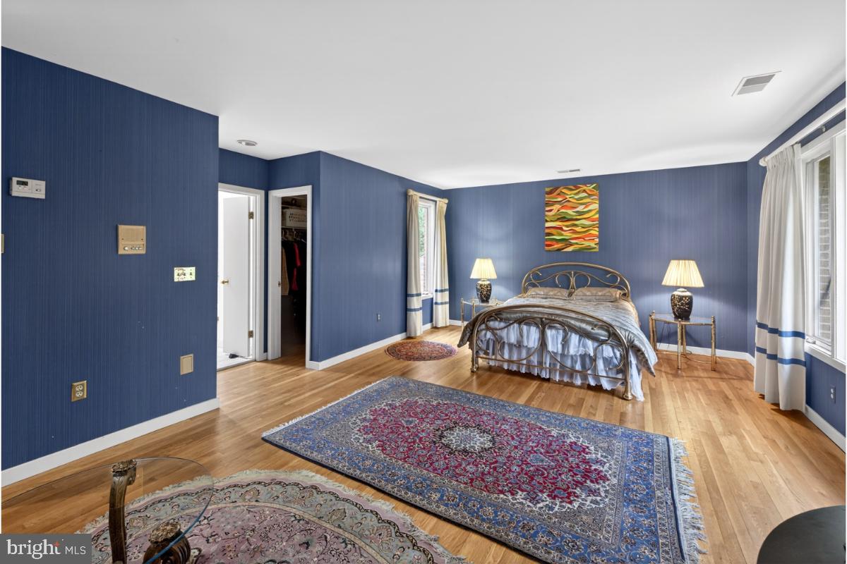 10320 Glen Road Potomac, MD 20854 - Photo 12 of 75 a bedroom with a bed and wooden floor