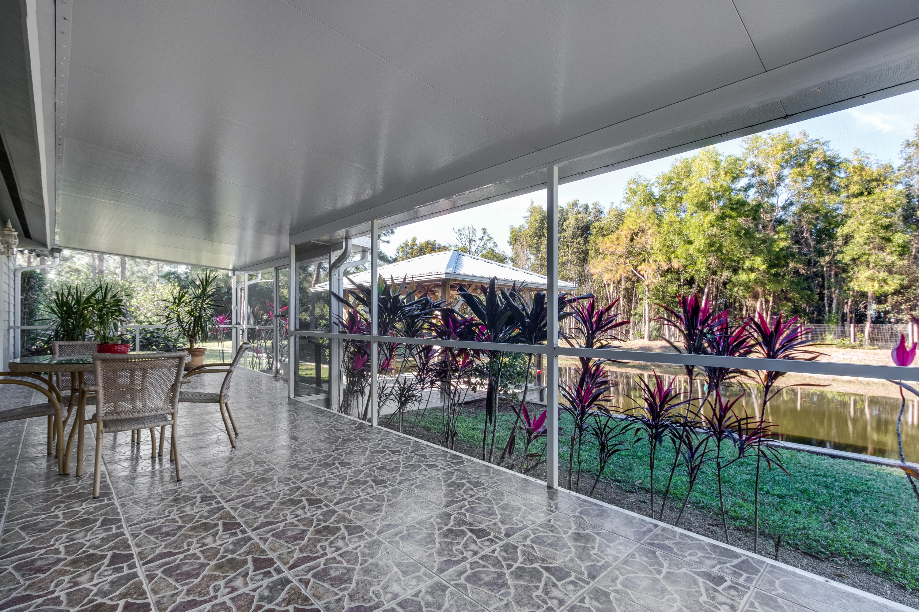 13281 165th Road North Jupiter, FL 33478 - Photo 19 of 28 Screened-in balcony/lanai