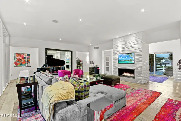 a kitchen with stainless steel appliances granite countertop a sink a stove and cabinets