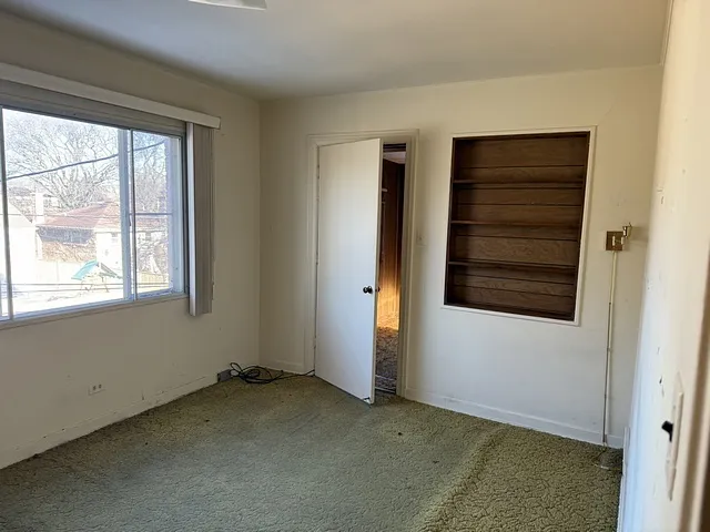 a bathroom with a granite countertop toilet and a shower