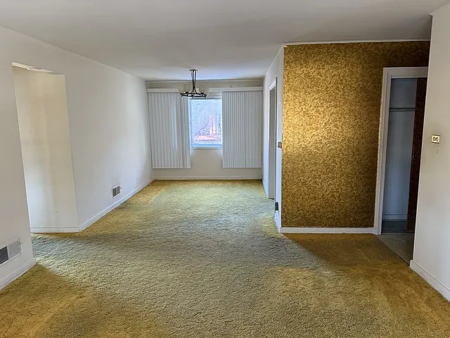 a kitchen with a stove a sink and a refrigerator