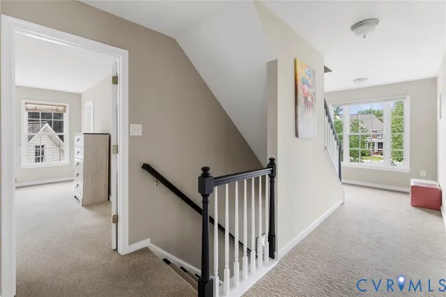 a view of a hallway view with staircase