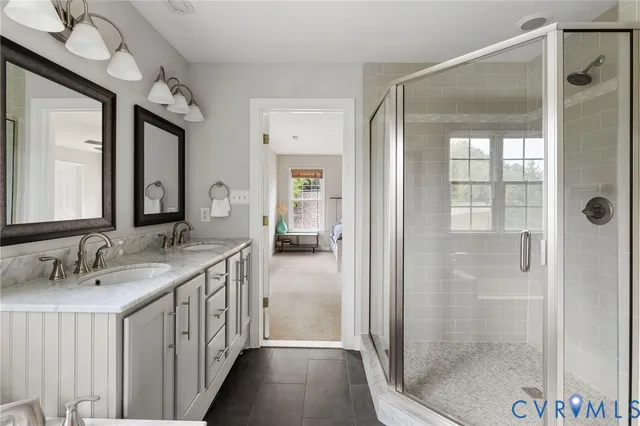 a bathroom with a double vanity sink and a mirror