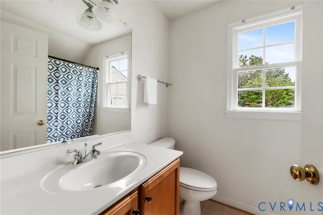 a bathroom with a sink toilet and a mirror