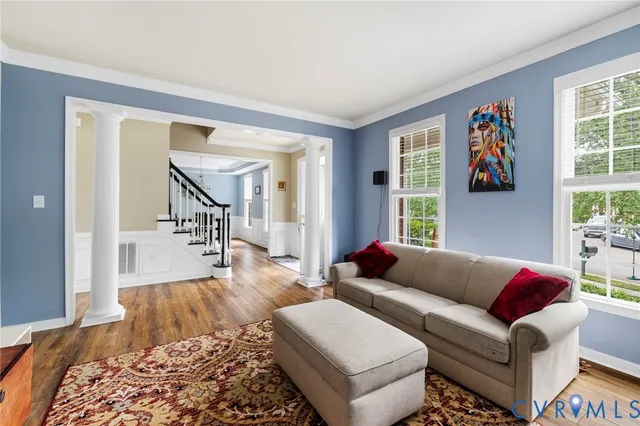 a living room with furniture and a window