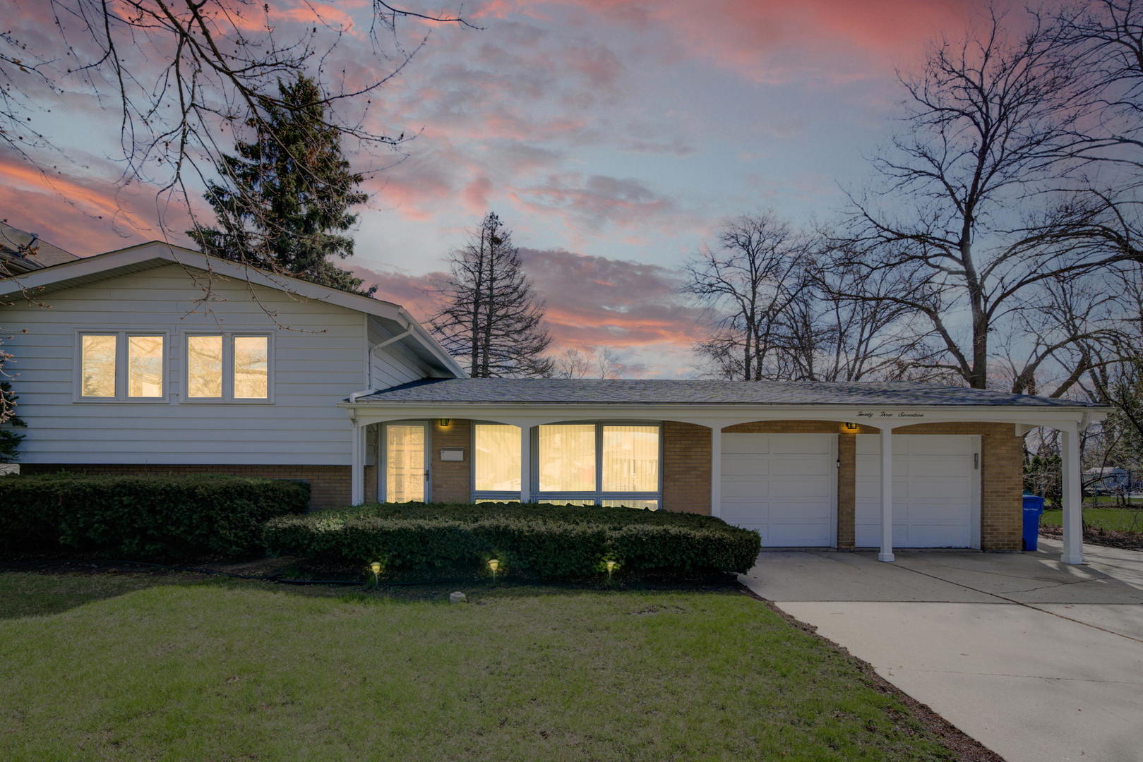 2317 High Ridge Parkway Hillside, IL 60162 - Photo 1 of 24 a view of a house next to a yard and large trees