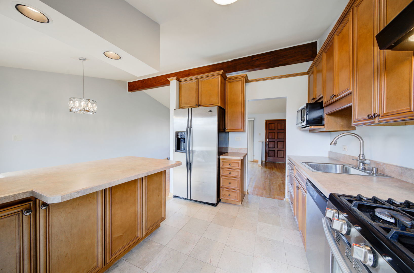 2317 High Ridge Parkway Hillside, IL 60162 - Photo 11 of 24 a kitchen with a sink and a refrigerator