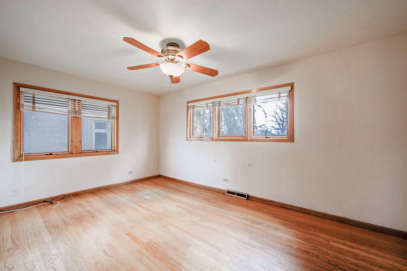 2317 High Ridge Parkway Hillside, IL 60162 - Photo 12 of 24 a view of an empty room with wooden floor and a window