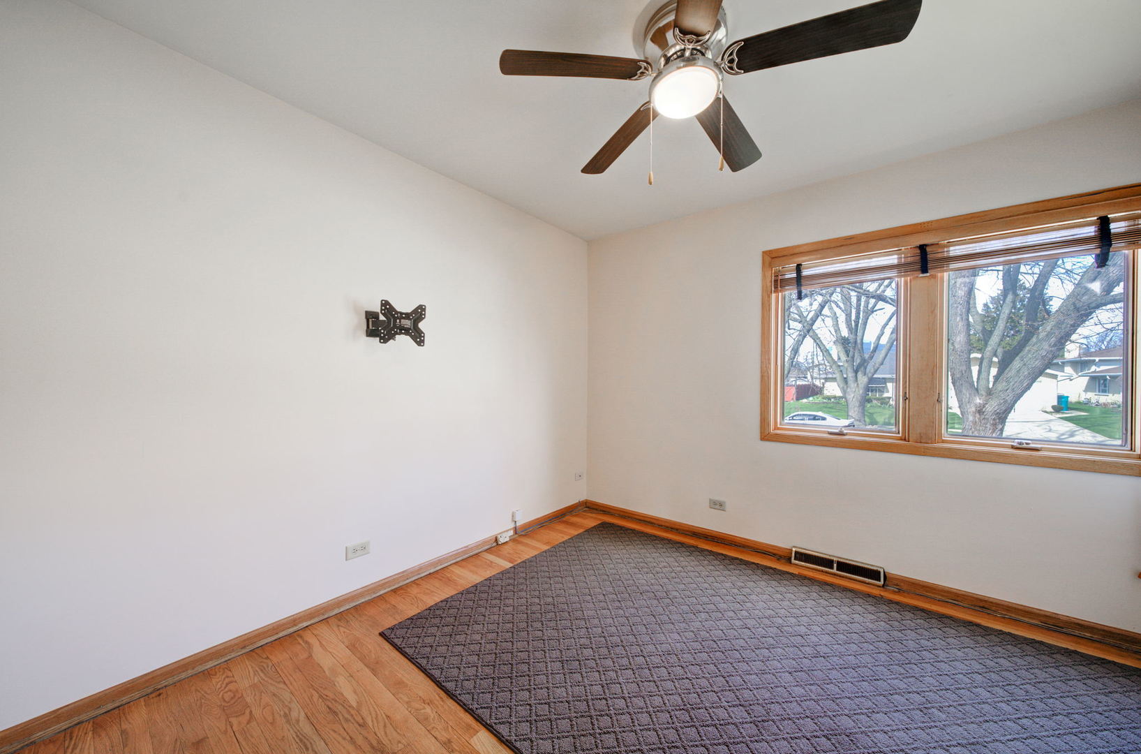 2317 High Ridge Parkway Hillside, IL 60162 - Photo 15 of 24 an empty room with a window and a ceiling fan