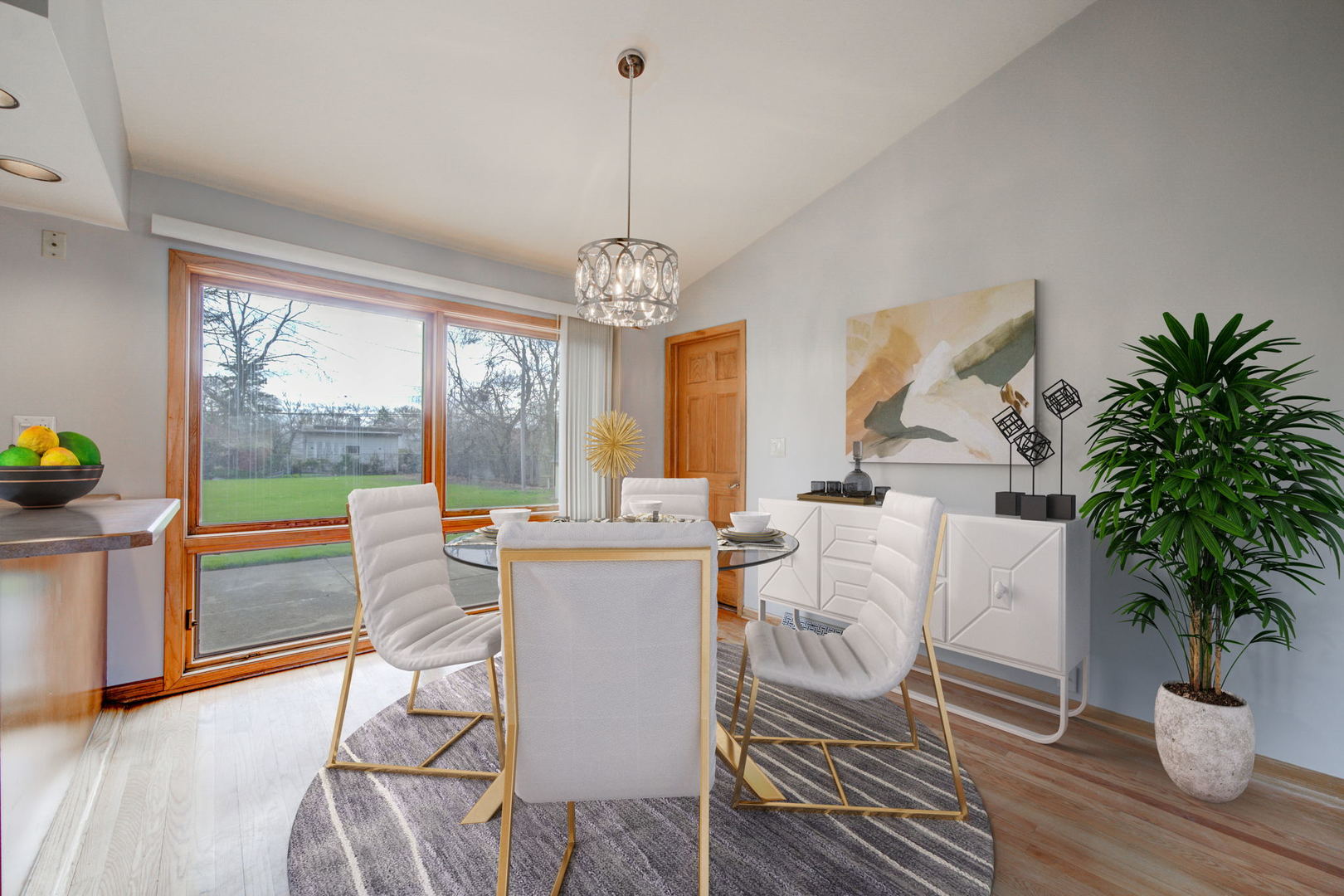 2317 High Ridge Parkway Hillside, IL 60162 - Photo 7 of 24 a dining room with furniture a chandelier and wooden floor