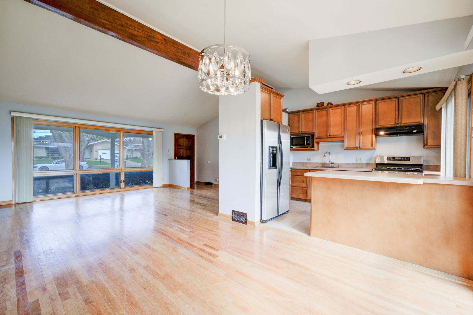 2317 High Ridge Parkway Hillside, IL 60162 - Photo 8 of 24 a kitchen with stainless steel appliances granite countertop a refrigerator a stove and a wooden floors