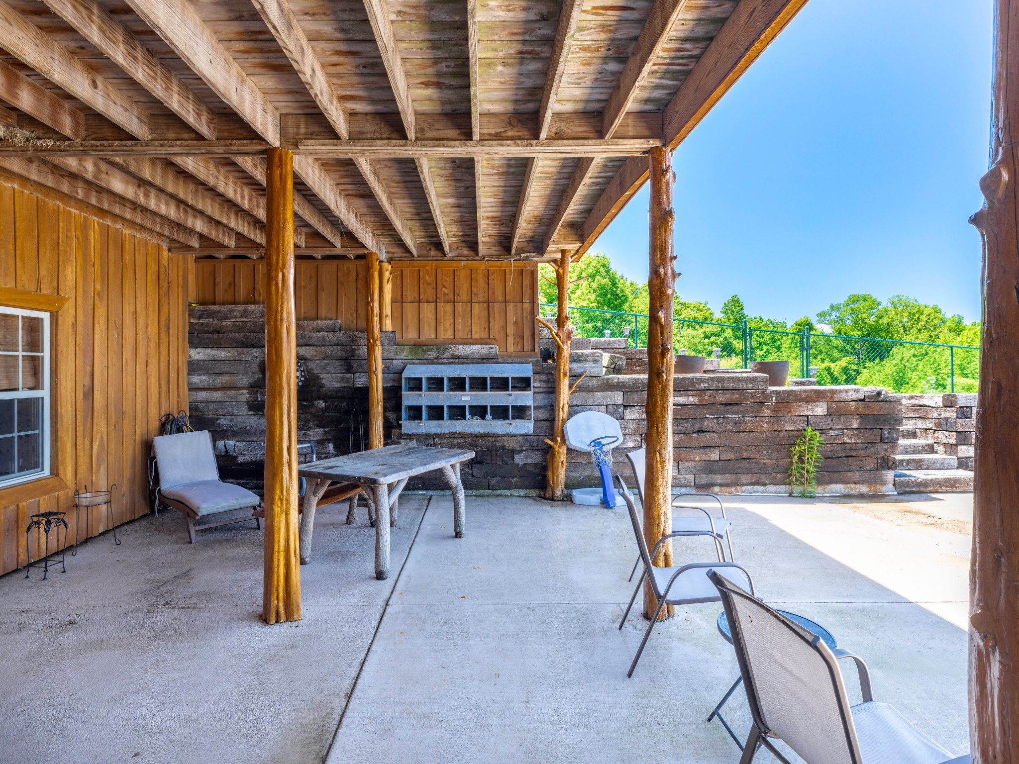 375 Good Hope Road Leoma, TN 38468 - Photo 8 of 23 a view of a porch with a table and chairs