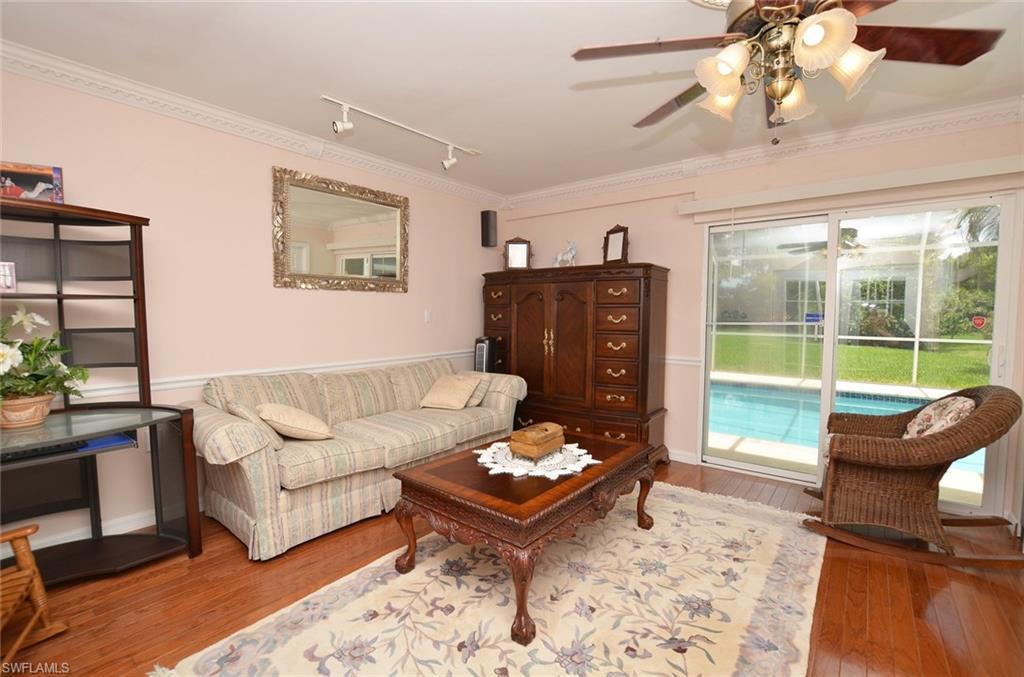 264 Henley Drive Naples, FL 34104 - Photo 17 of 25 a living room with furniture and a large window