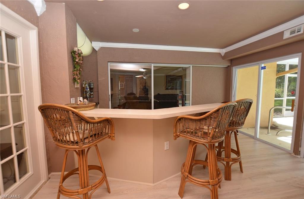 264 Henley Drive Naples, FL 34104 - Photo 21 of 25 a view of a dining room with furniture window and outside view
