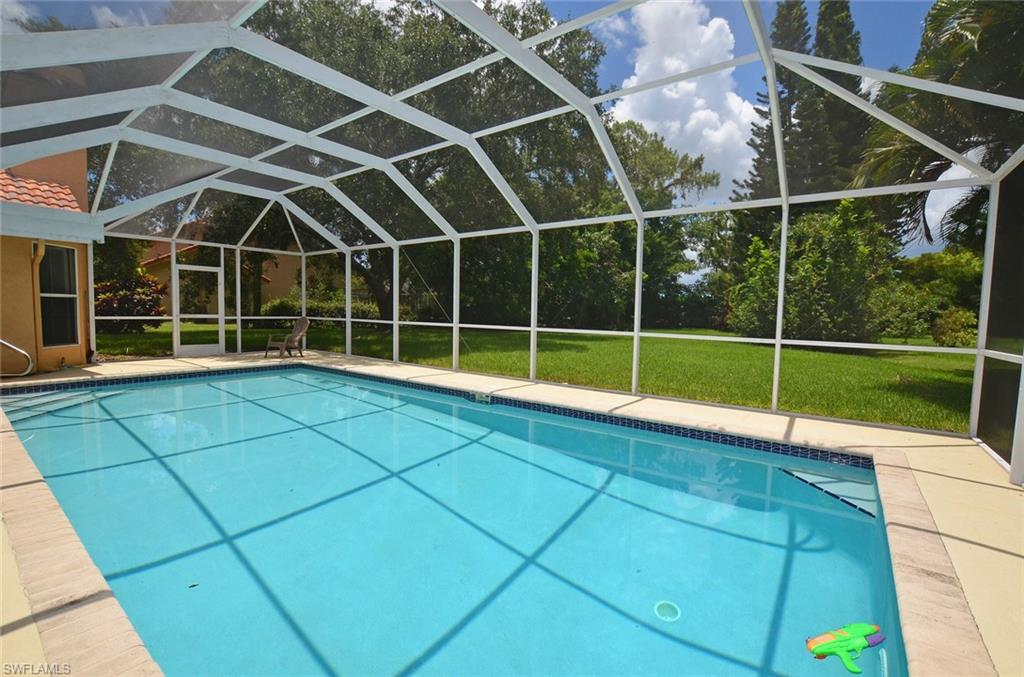 264 Henley Drive Naples, FL 34104 - Photo 22 of 25 a view of a room with wooden floor and windows