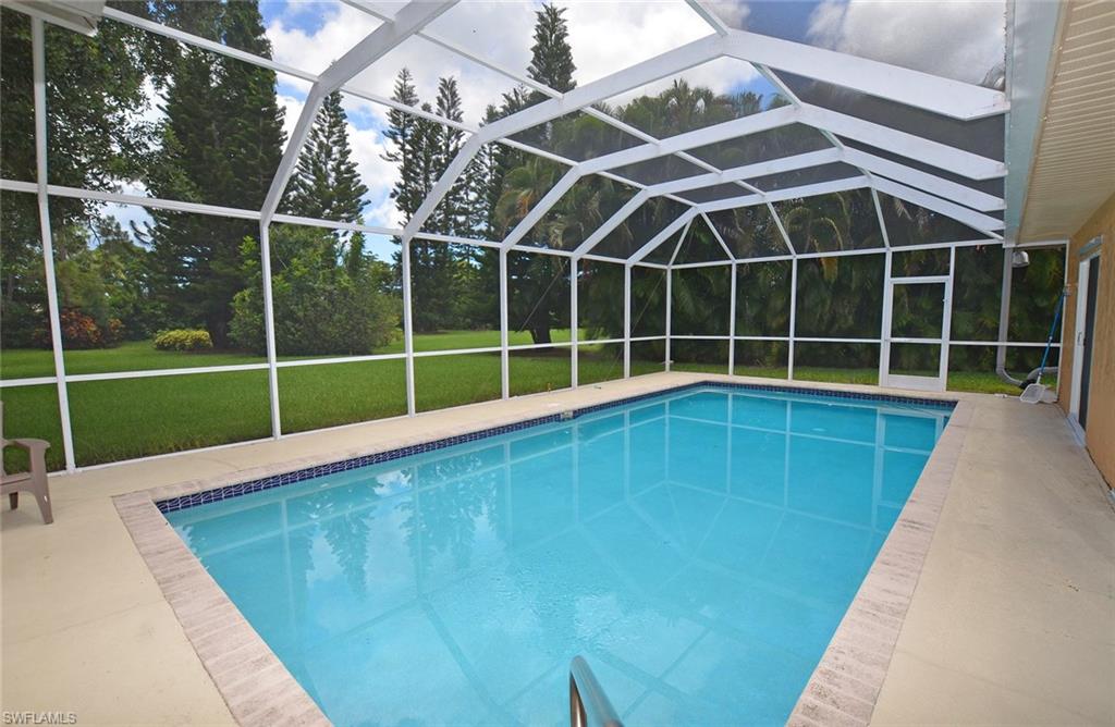 264 Henley Drive Naples, FL 34104 - Photo 23 of 25 a view of outdoor space with a swimming pool