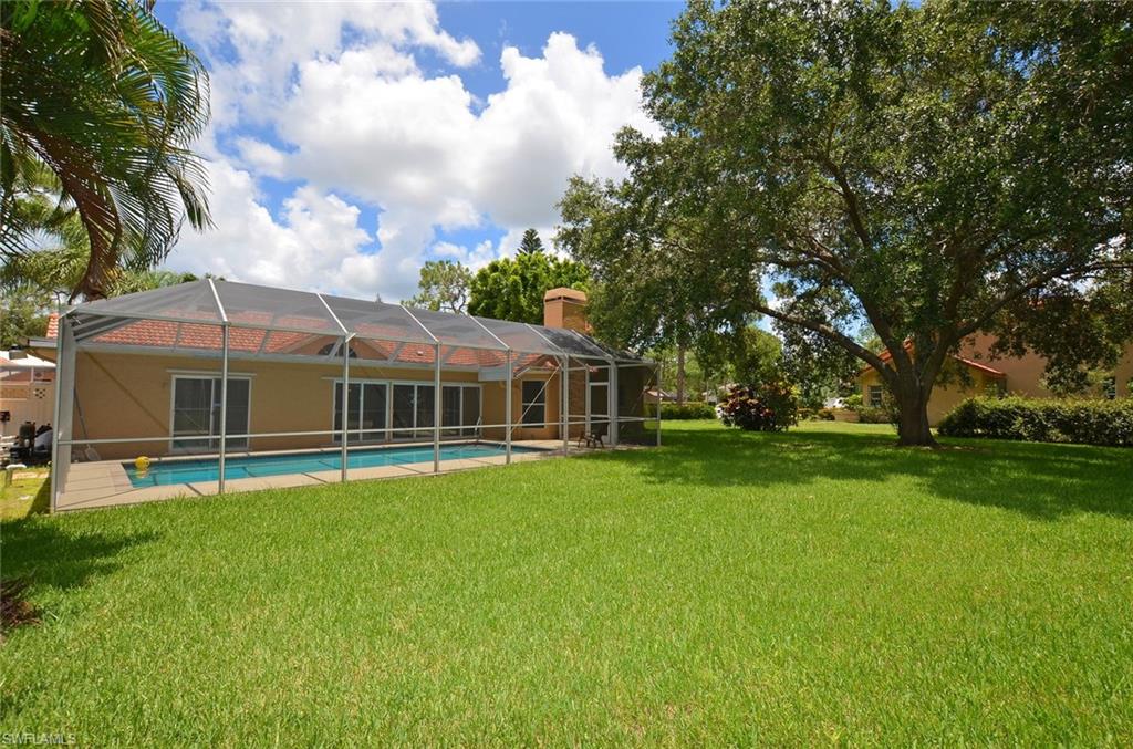 264 Henley Drive Naples, FL 34104 - Photo 25 of 25 a view of a house with a big yard
