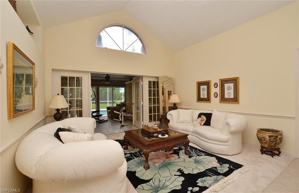 264 Henley Drive Naples, FL 34104 - Photo 6 of 25 a living room with furniture and a large window