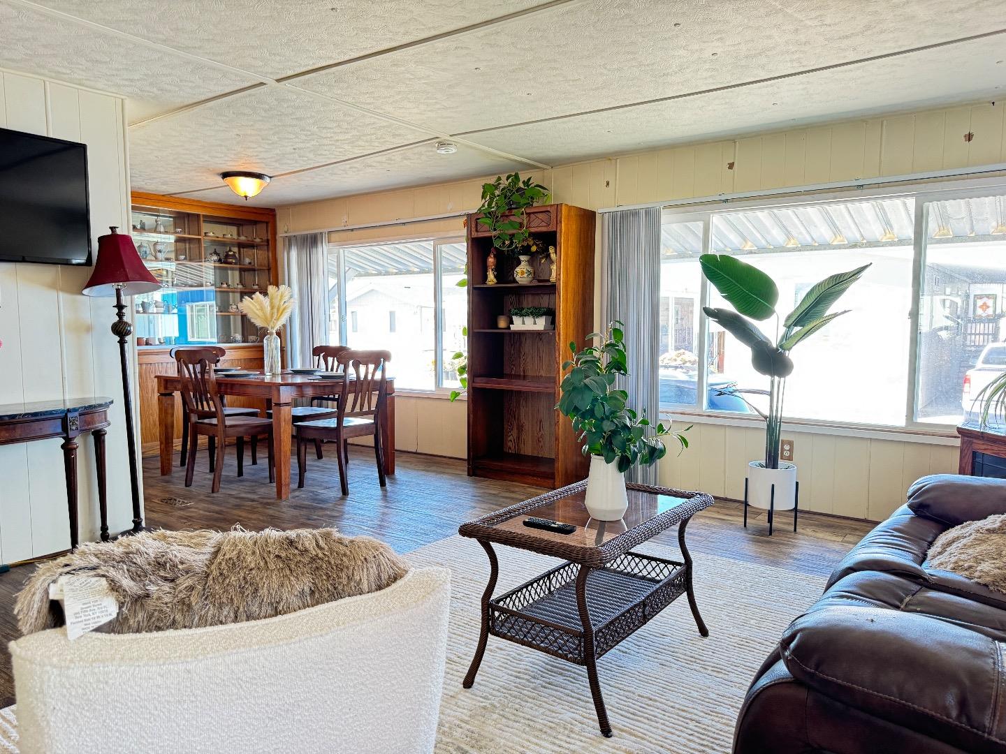 55 San Juan Grade Road, Unit 79 Salinas, CA 93906 - Photo 6 of 22 a living room with furniture and a flat screen tv