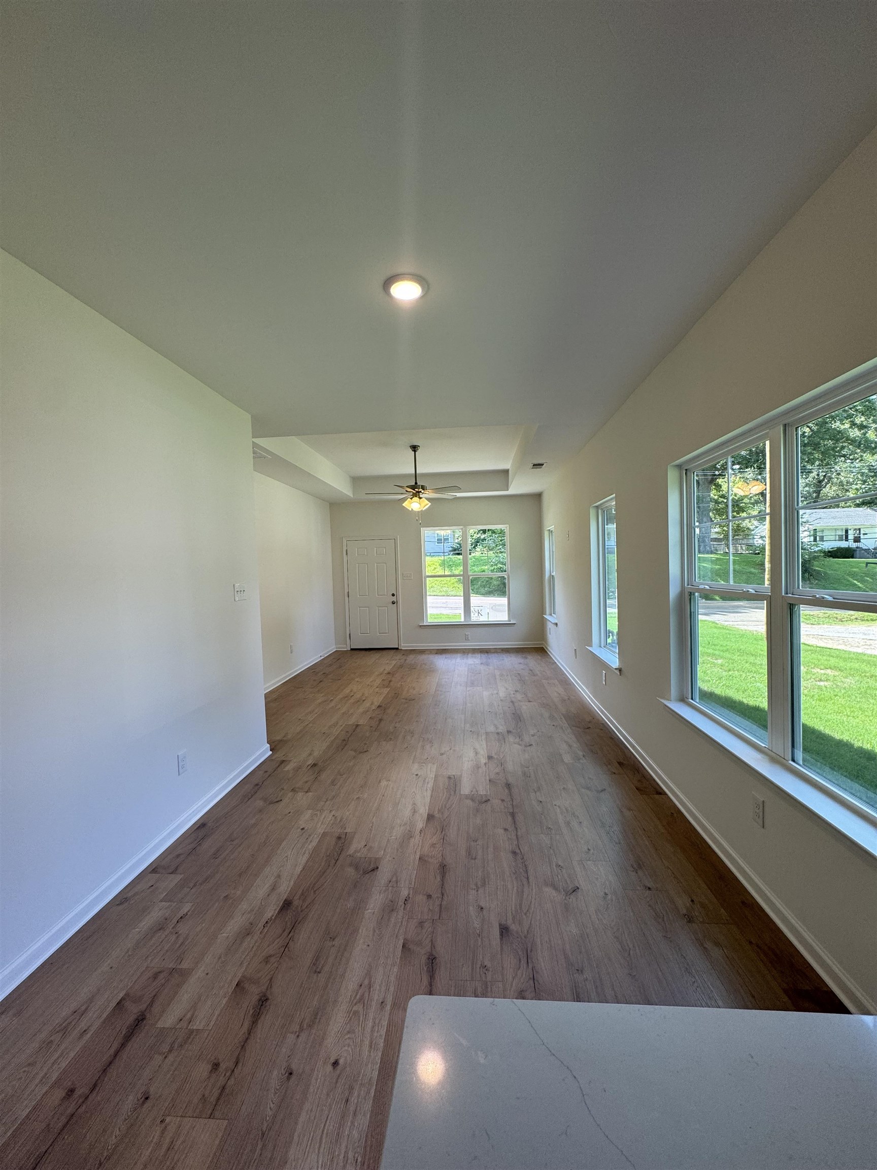 12370 South Main Street Somerville, TN 38068 - Photo 9 of 26 Spacious interior with wood-finish flooring, recessed lighting, and a tray ceiling