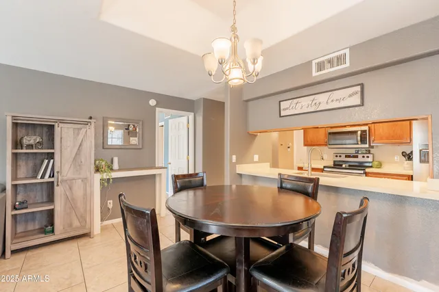 a view of a dining room with furniture and a fireplace