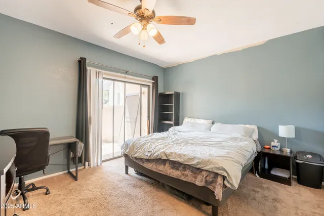 a bedroom with a bed and a tv