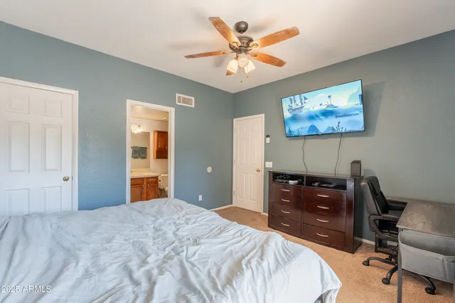 a bedroom with a bed and a cabinets