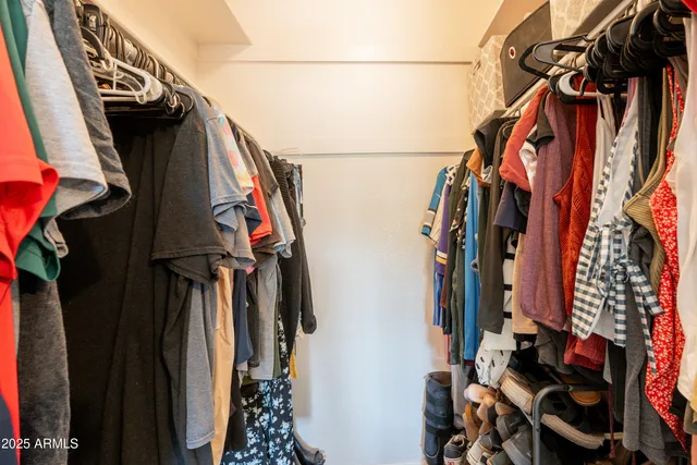 a bed room with furniture and a window