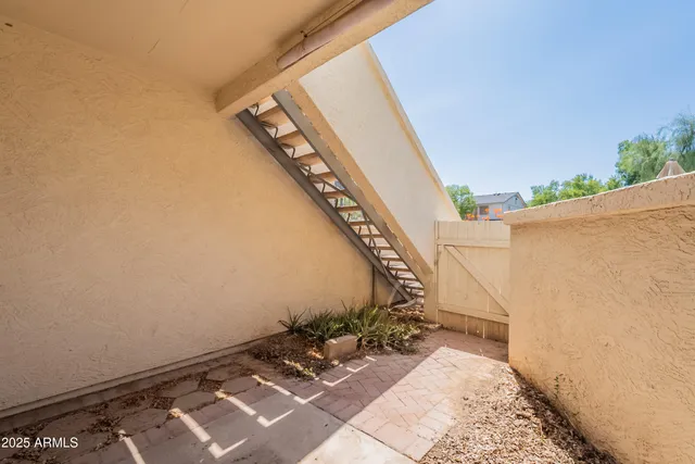 front view of a house with a bench