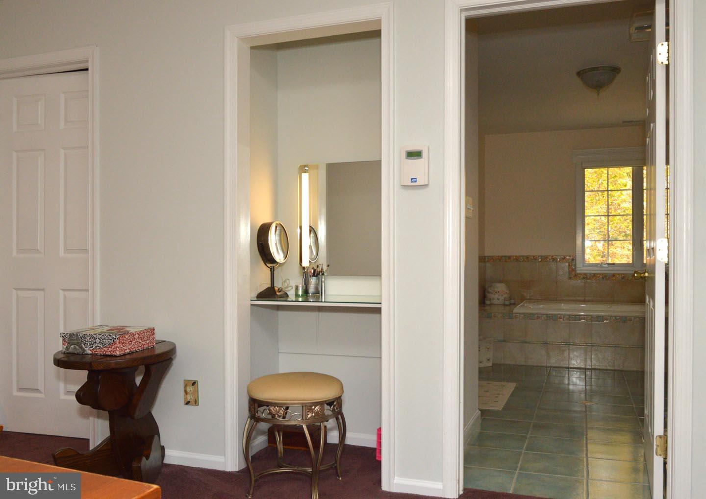 16 Ginger Road Chesterfield, NJ 08515 - Photo 13 of 27 a view of a bathroom with a sink and mirror