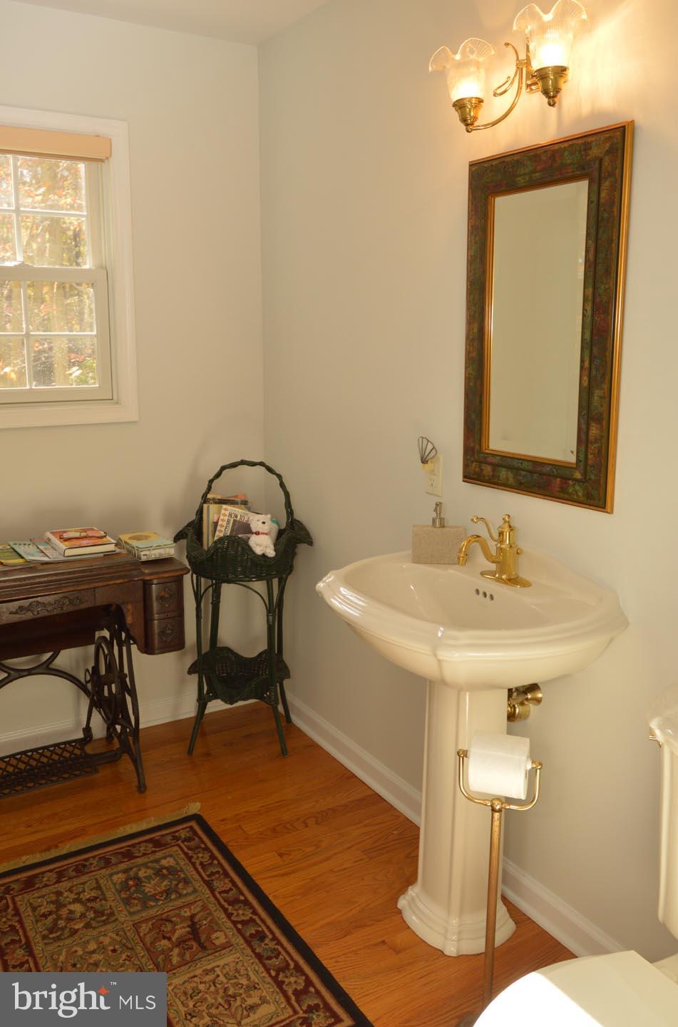 16 Ginger Road Chesterfield, NJ 08515 - Photo 19 of 27 a bathroom with a sink and a mirror