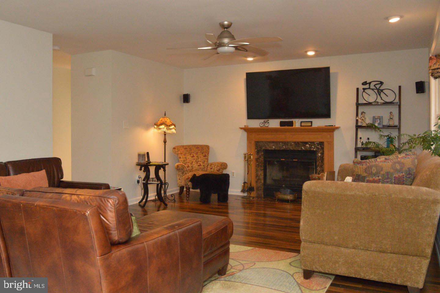 16 Ginger Road Chesterfield, NJ 08515 - Photo 6 of 27 a living room with fireplace furniture and a flat screen tv