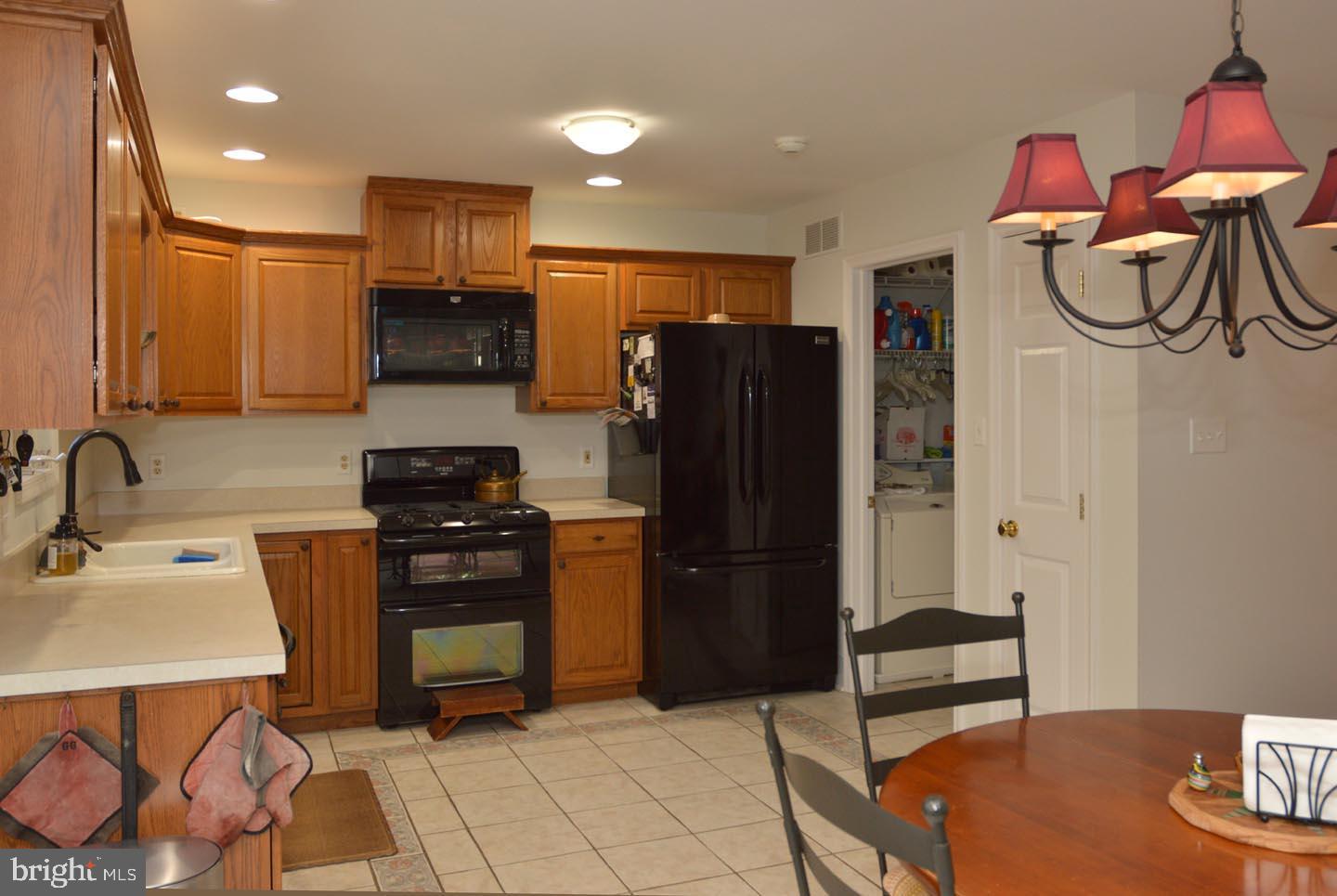 16 Ginger Road Chesterfield, NJ 08515 - Photo 9 of 27 a kitchen with stainless steel appliances a refrigerator and a sink