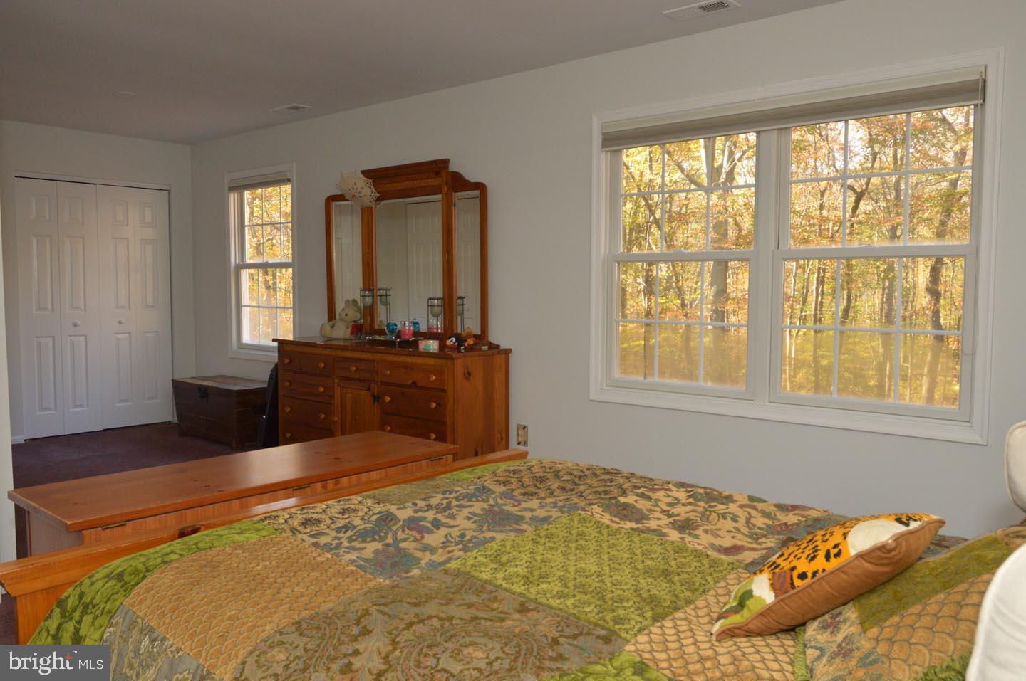 16 Ginger Road Chesterfield, NJ 08515 - Photo 10 of 27 a bed sitting in a bedroom next to a window