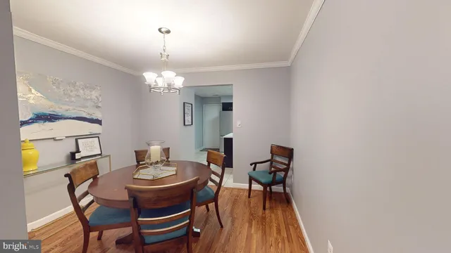 a bedroom with a bed and a refrigerator