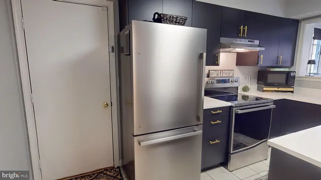 a workspace with a window and a lamp