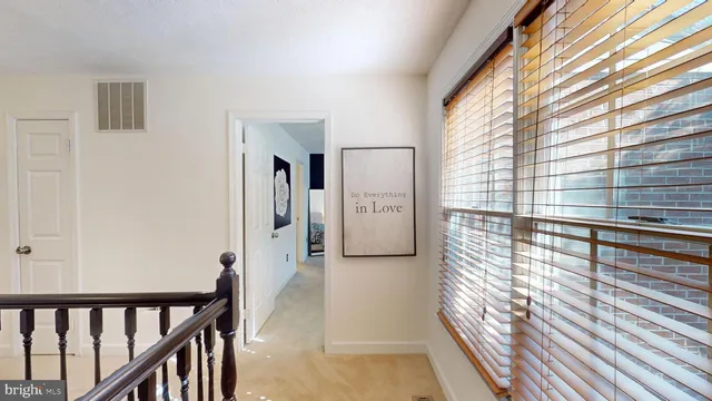 a bedroom with a bed and a mirror