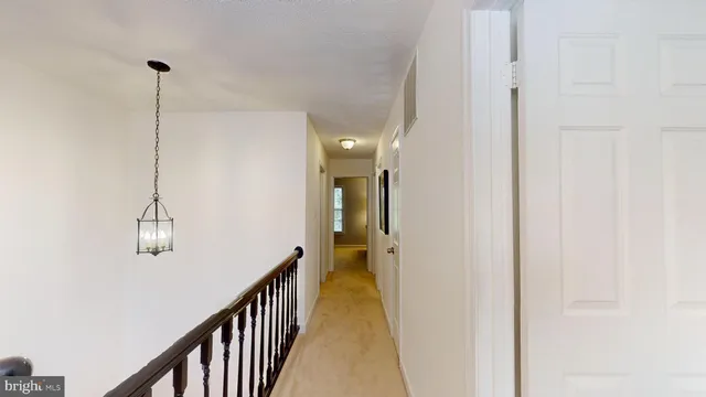a bathroom with a toilet and a shower curtain