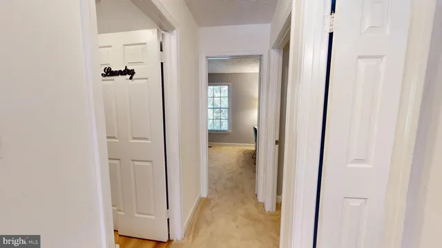a view of backyard with wooden floor and fence