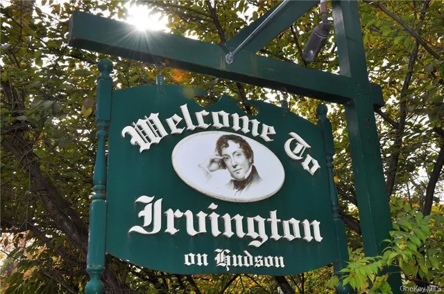 a sign that is on a brick wall