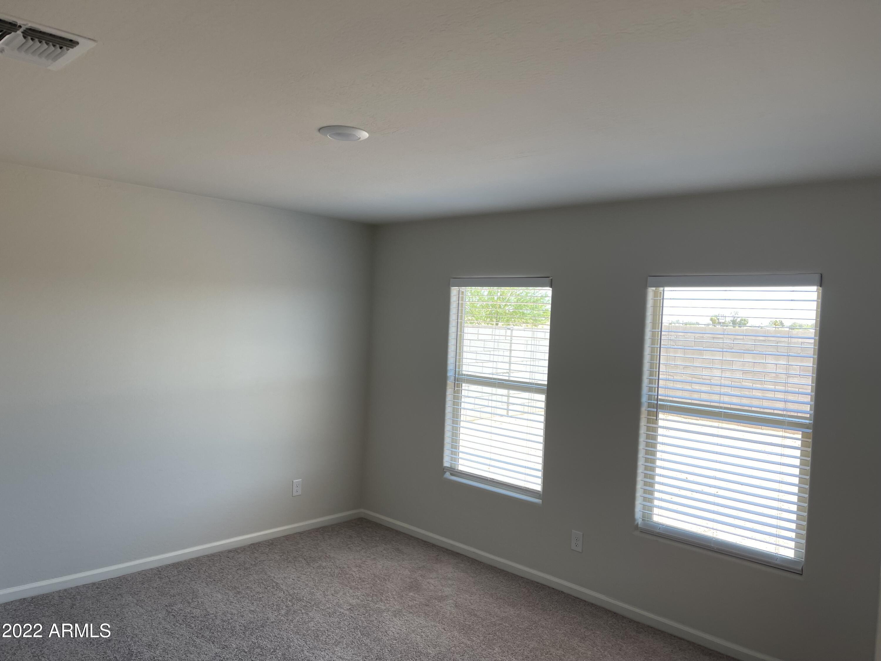 1099 9th Place Coolidge, AZ 85128 - Photo 11 of 11 an empty room with a window