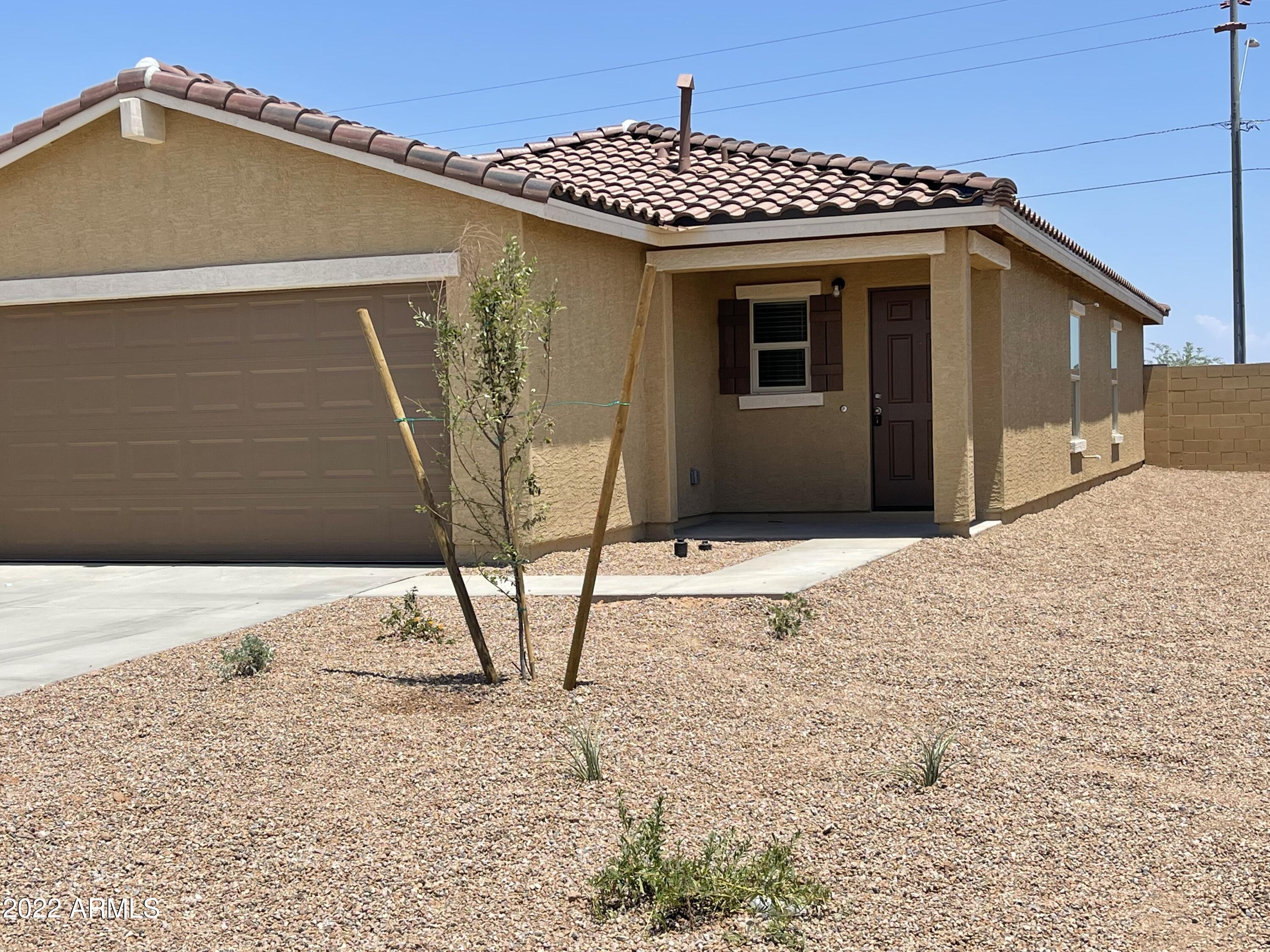 1099 9th Place Coolidge, AZ 85128 - Photo 2 of 11 a front view of a house