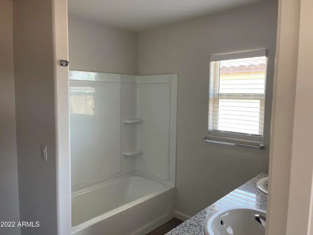 a bathroom with a shower and bathtub