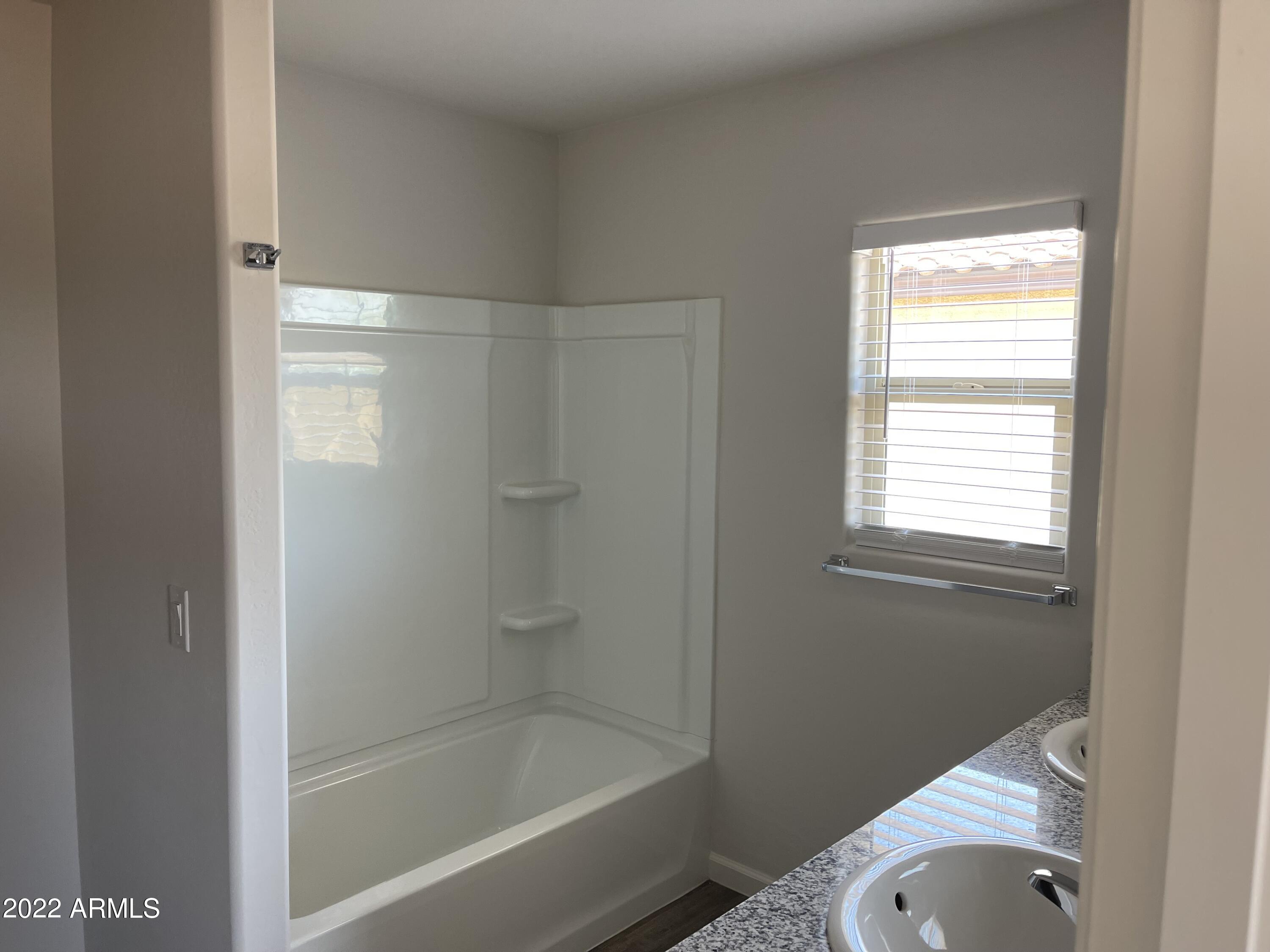 1099 9th Place Coolidge, AZ 85128 - Photo 10 of 11 a bathroom with a shower and bathtub